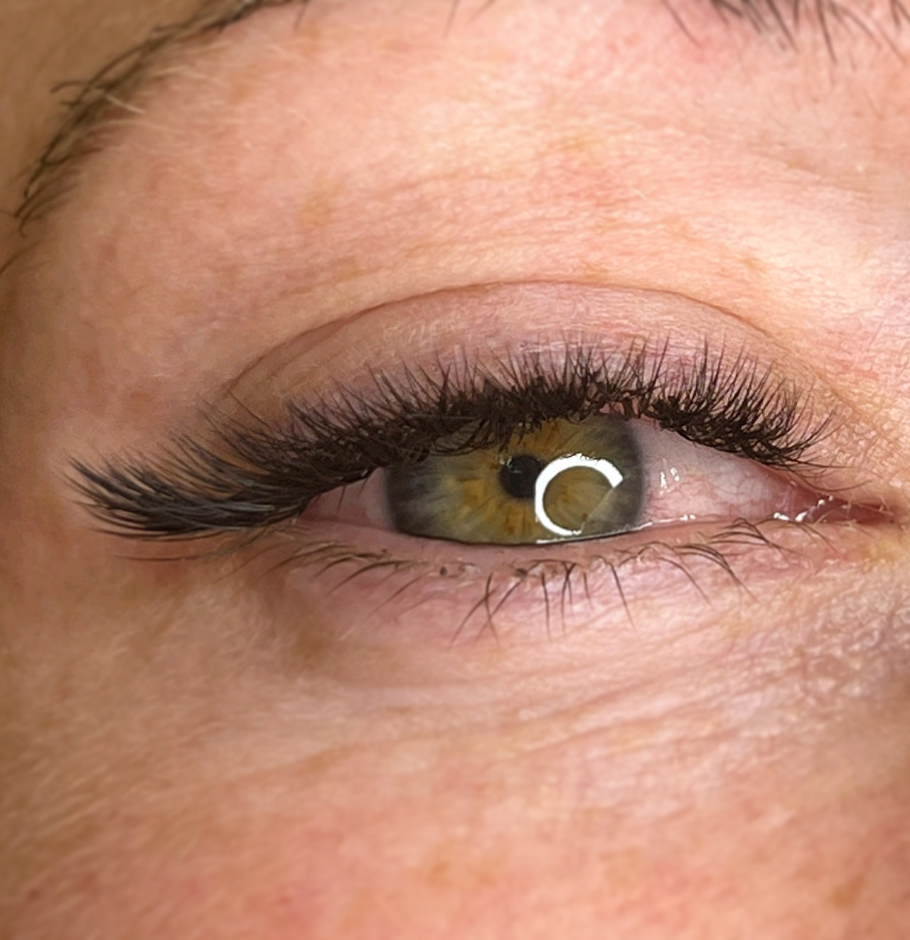 Soft lash extensions on a hazel eye