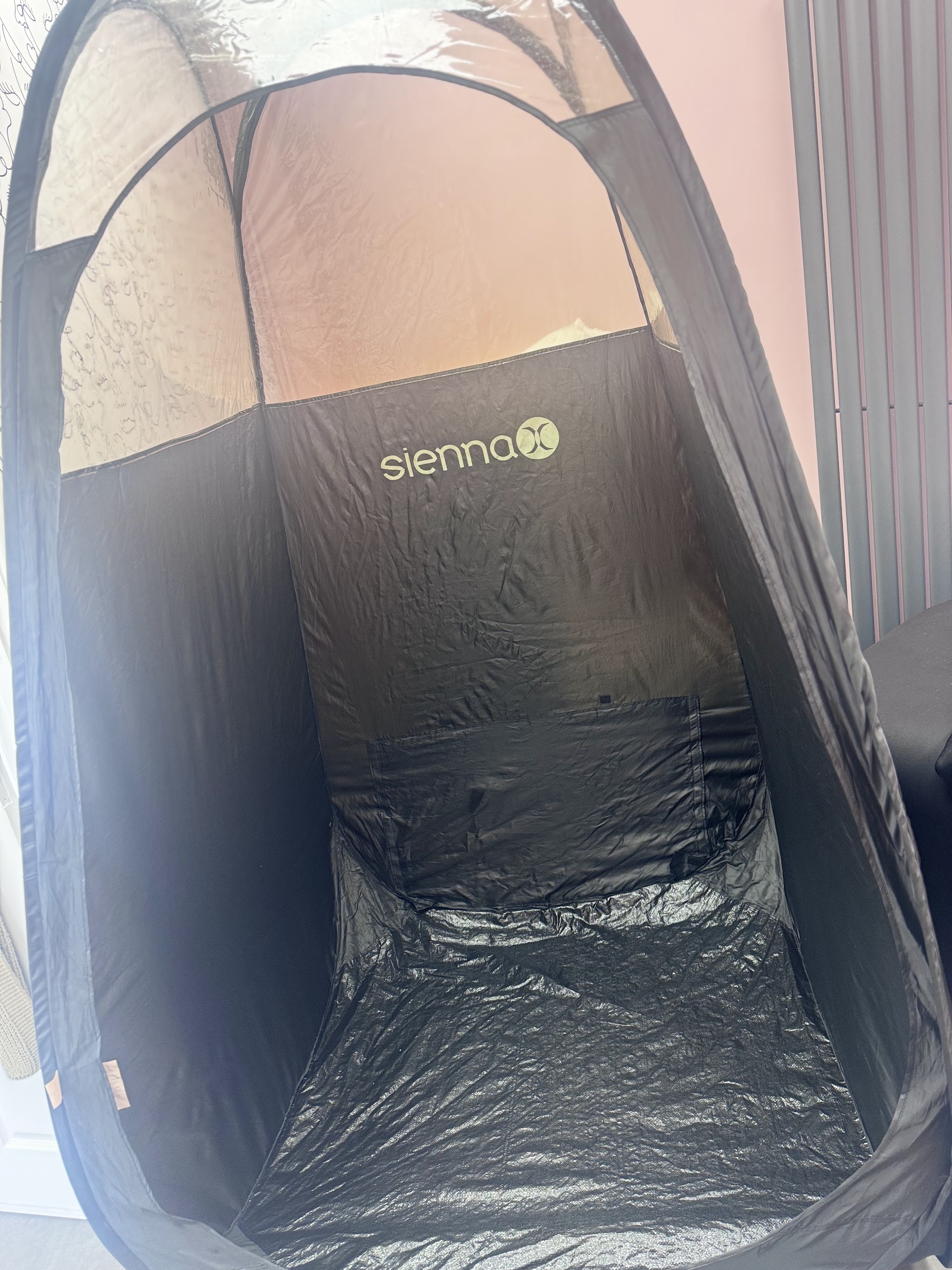 The Sienna X spray tan booth set up in the studio
