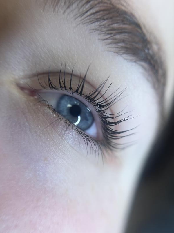 Natural-looking lash extensions on a blue eye