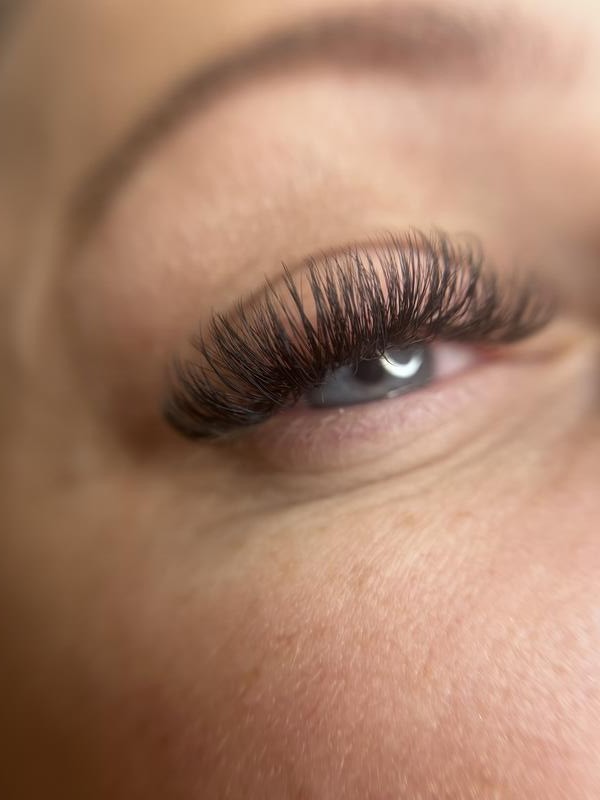 A full lash extension set seen in profile